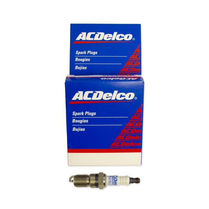 ACDelco spark plug kit featuring two blue and white product boxes labeled in English and French, with a single spark plug displayed in front.